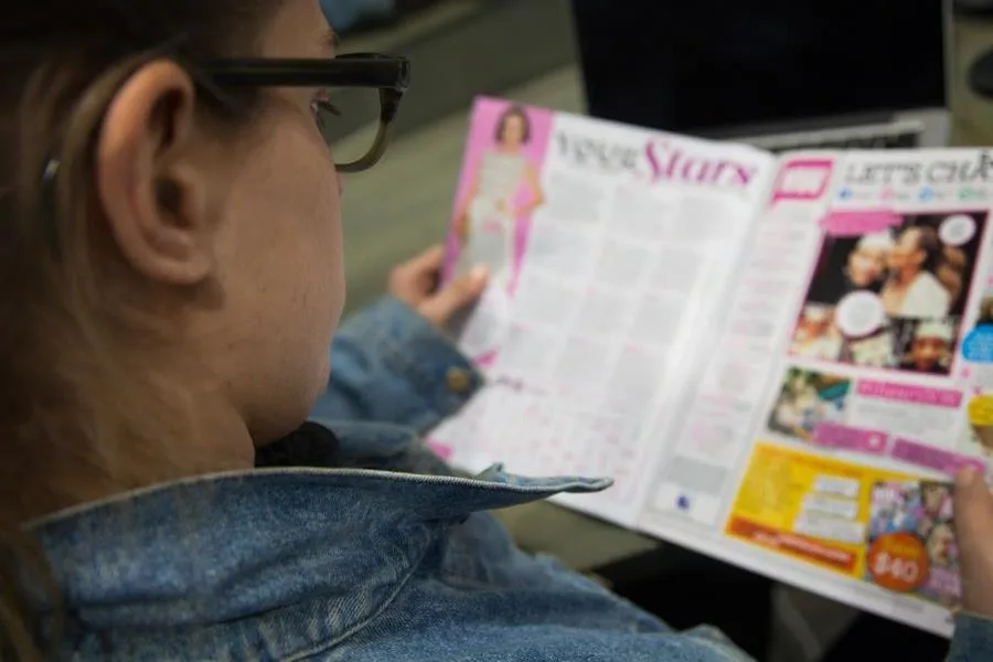 Girl reading a magazine