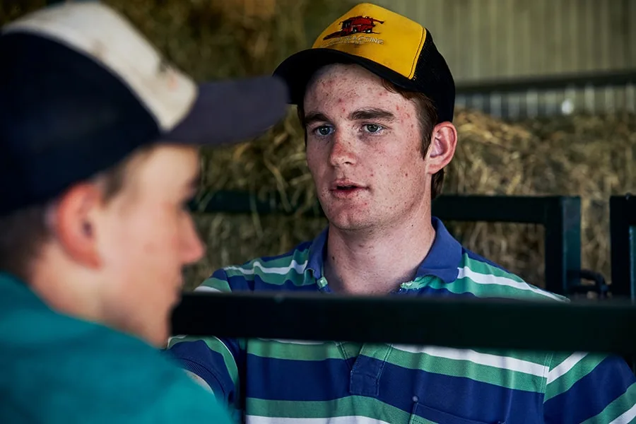 guy in cap looking at friend