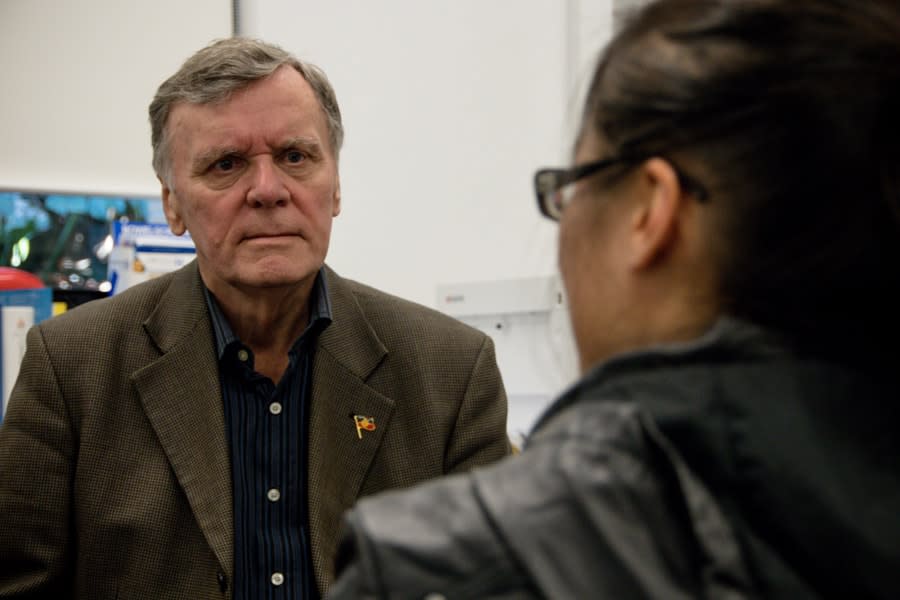 older man talking to girl