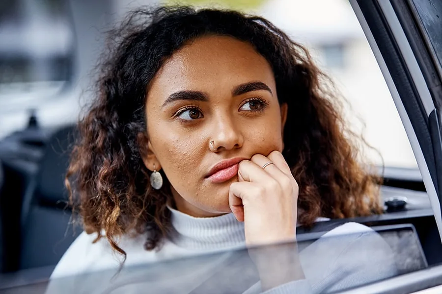 girl looking out of car window