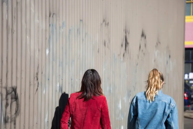 2 girls walking and talking