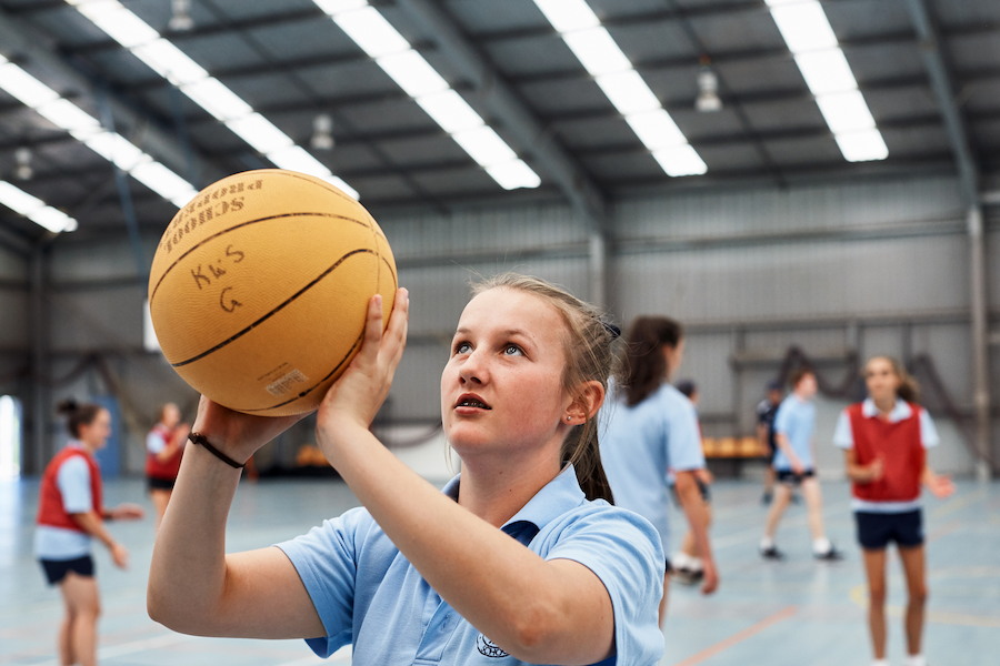 Make a move student with basketball