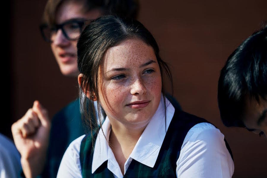 girl in school uniform looking in distance