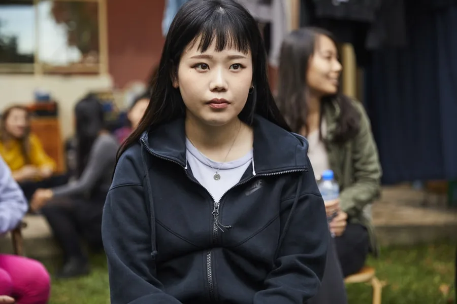 asian girl in group of people