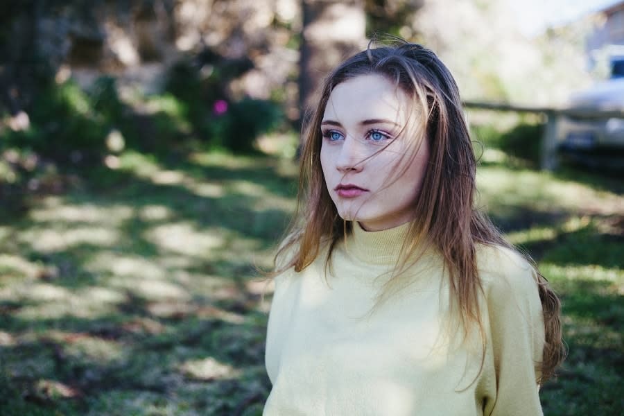 Girl with blue eyes in yellow shirt