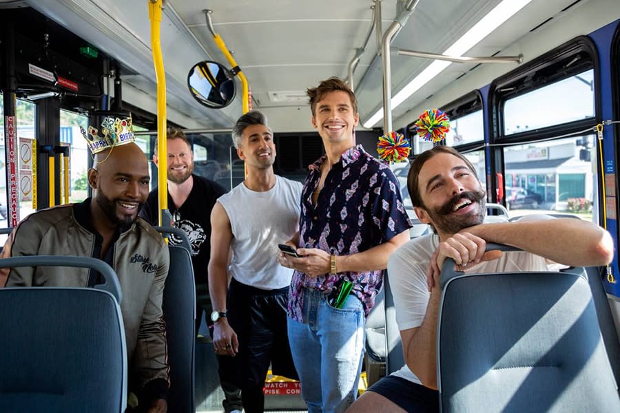 five men smiling on bus queer eye