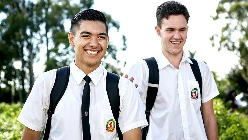 2 school boys laughing