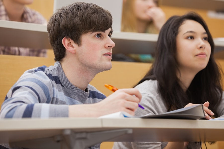 Boy with striped sweater and girl in lecture