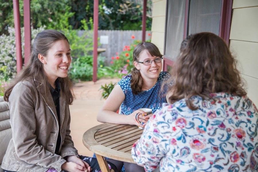 Girls smiling at table