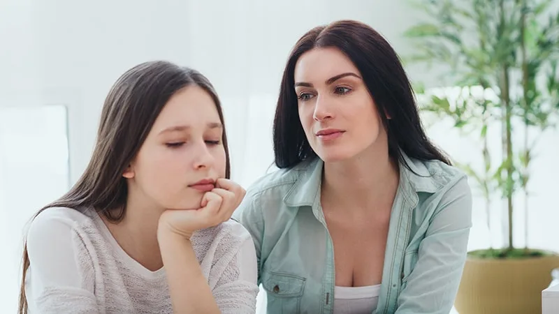 Mother and daughter talking seriously