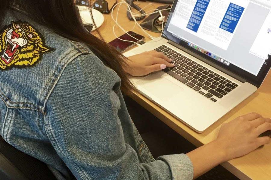 Girl at desk with laptop