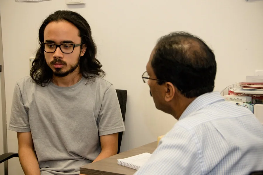 Boy talking to a doctor