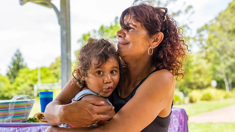 Aboriginal woman hugging grandchild (1)