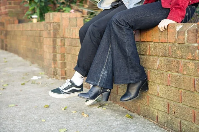 Girls sitting on wall