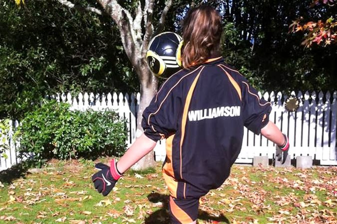 girl kicking soccer ball