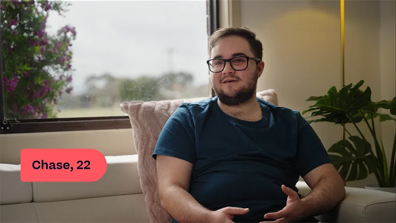 chase young man sitting on couch and talking