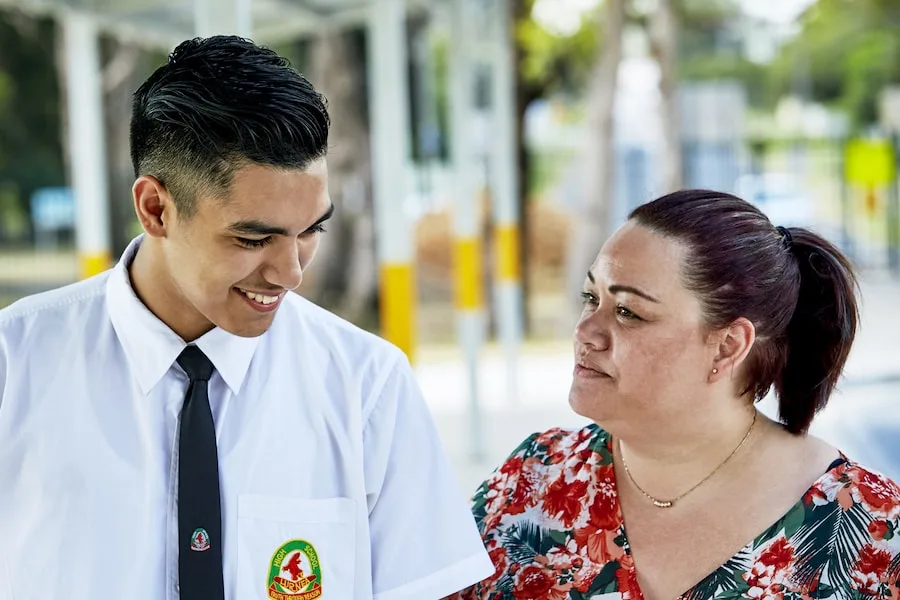 student and teacher walking together