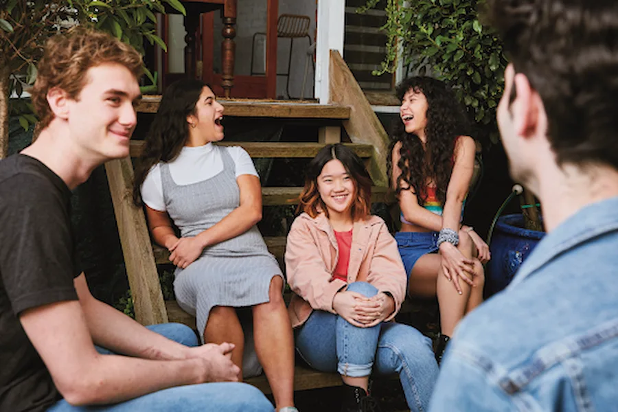 Friends sitting around laughing