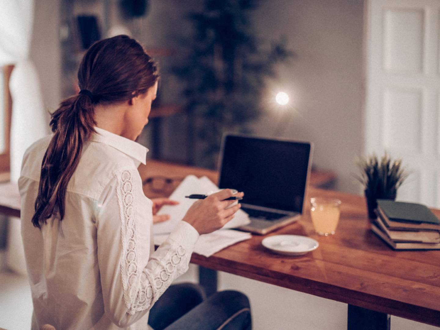 girl working behind her computer