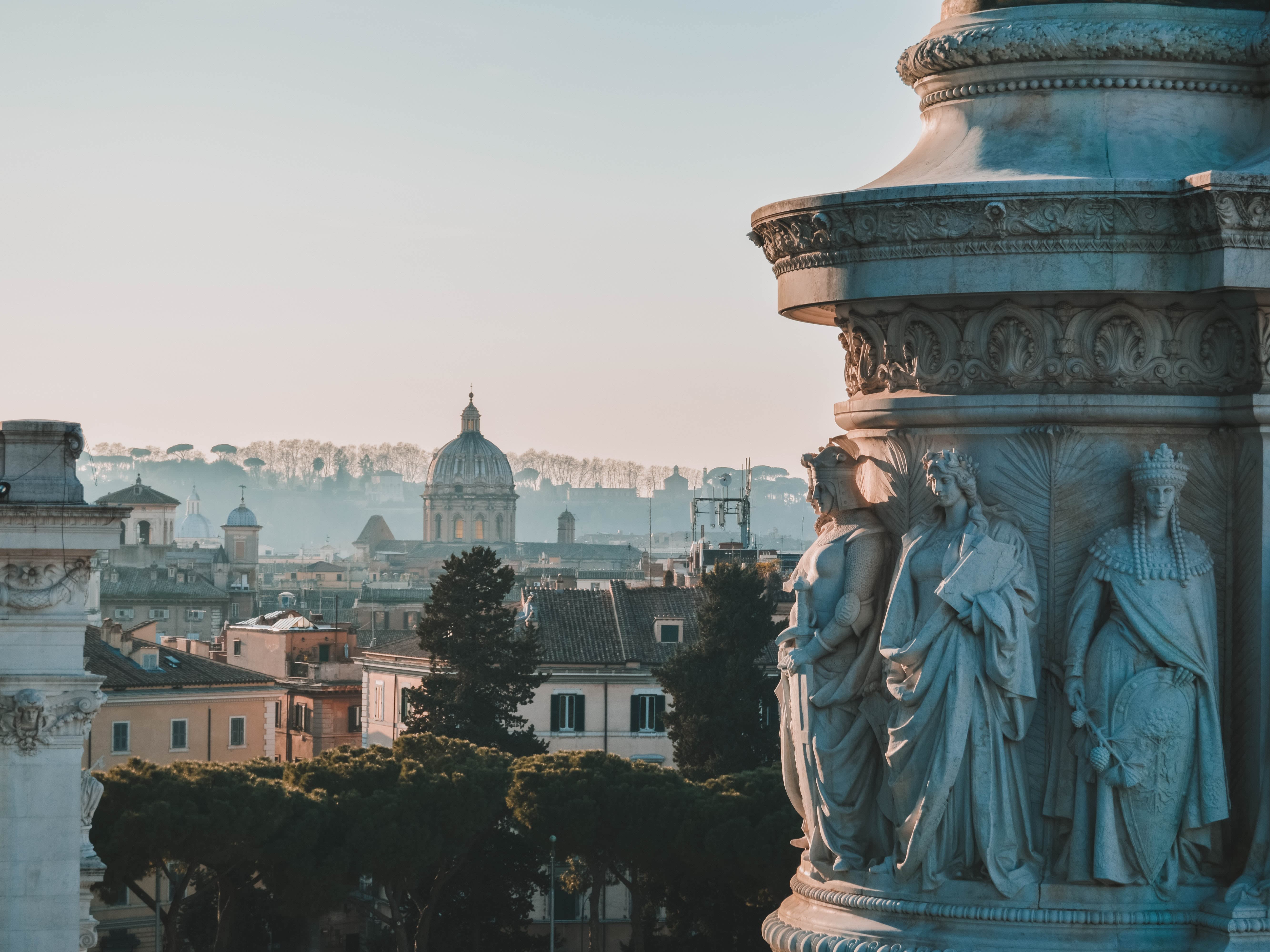 a picture of rome view and statues