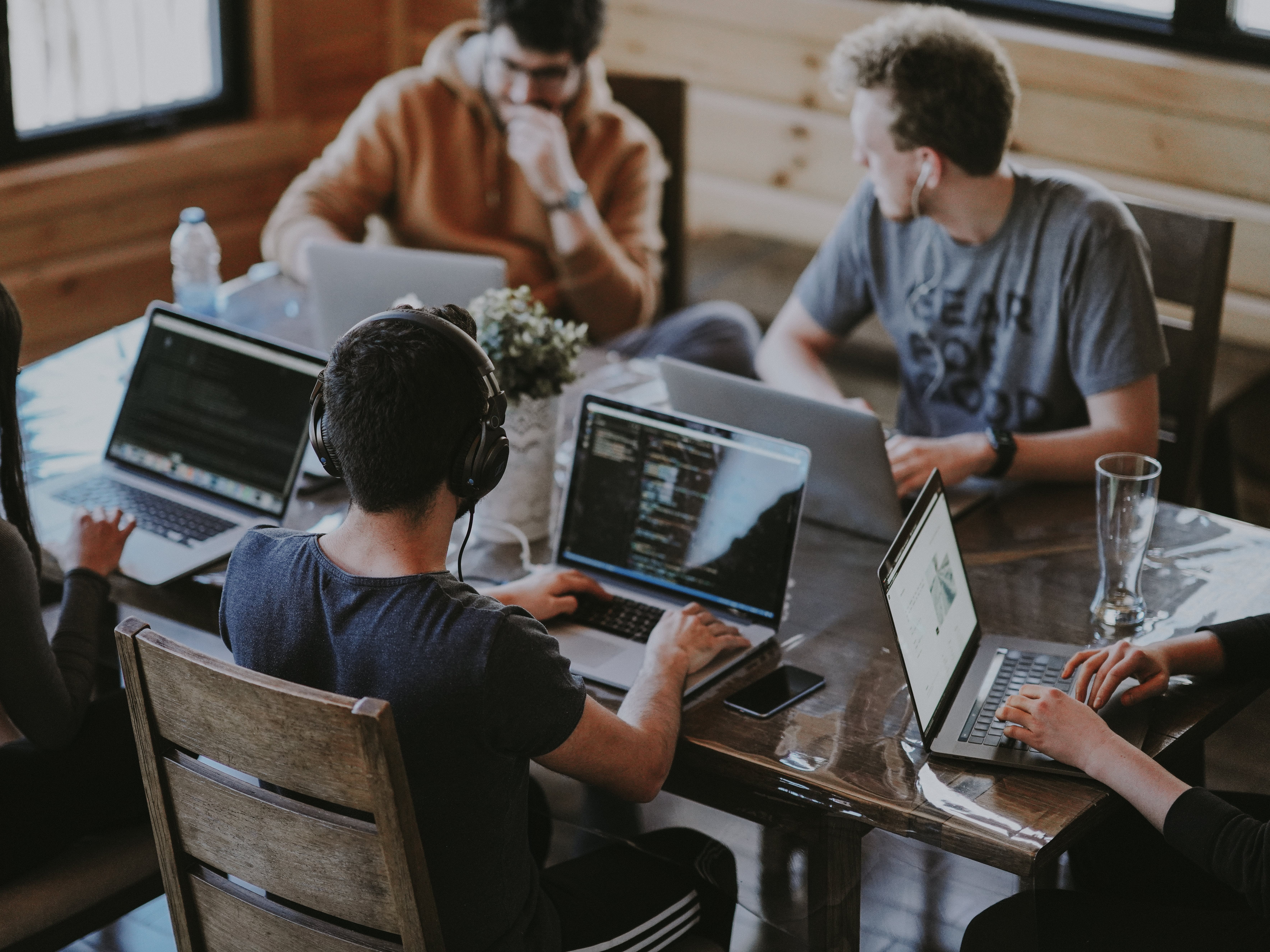 People sitting around a table and working on a shared work project