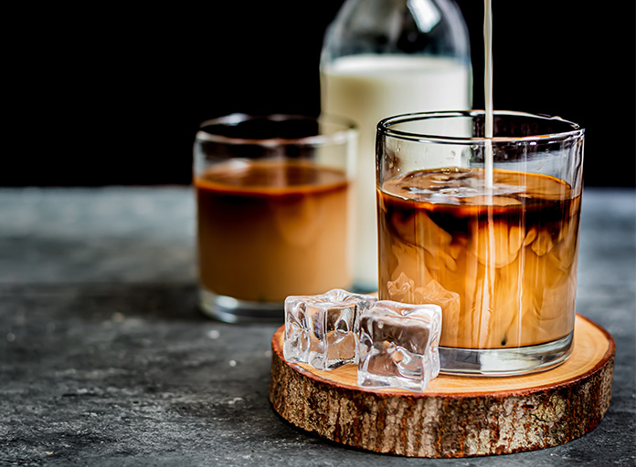Cold Brew Coffee with milk in the background