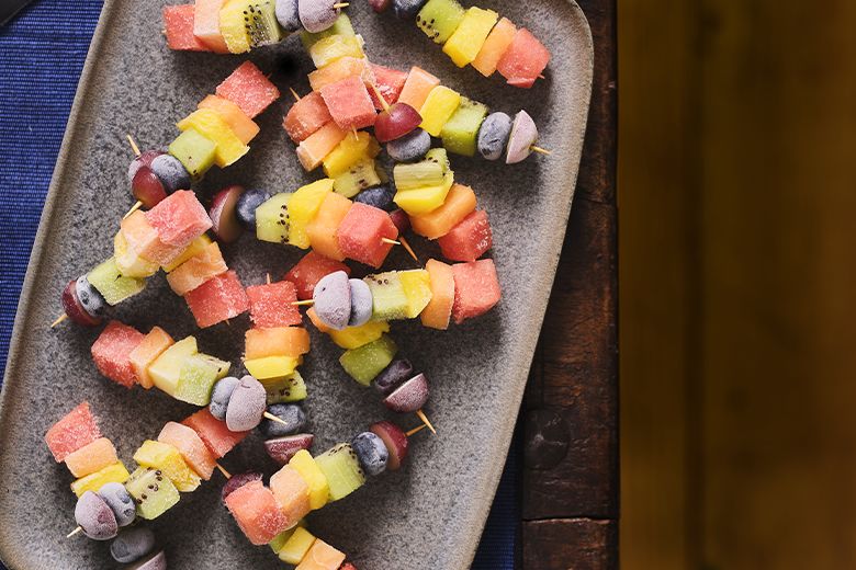 Rainbow frozen fruit kebabs