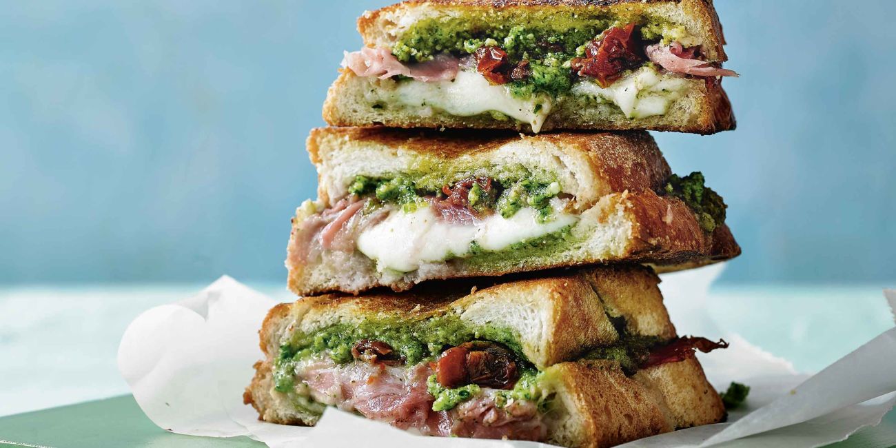 Prosciutto and mozzarella toasted sandwich with spring green pesto