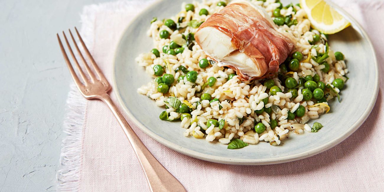 Roasted cod with Prosciutto and pea risotto