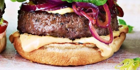 Beef rib burger with five cheese sauce and sticky onions