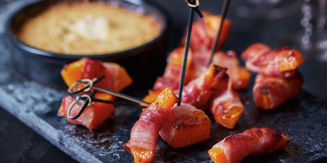Bacon-wrapped squash with Cheddar bake