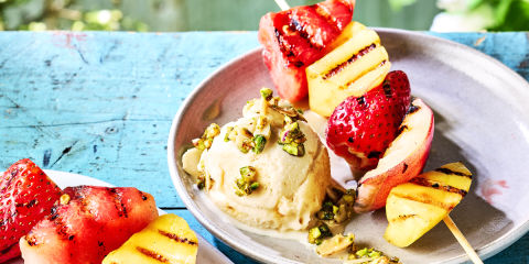 Fruit kebabs with vegan ice cream & chopped nuts