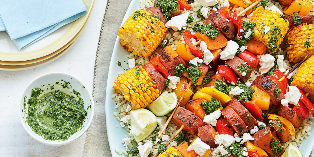 Veggie kebab platter with chimichurri sauce