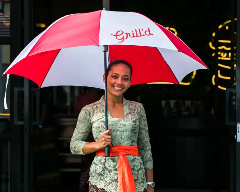 Grill'd talent holding Umbrella