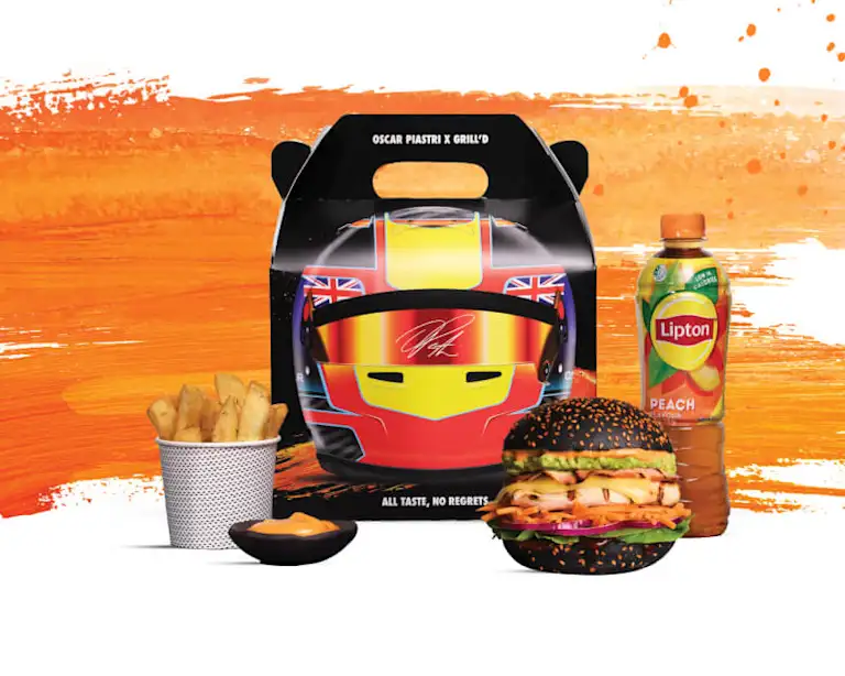 Oscar Piastri Chicken burger pack, with chips, dip, Lipton Iced Tea and a limited edition box featuring a graphic of Oscar's racing helmet