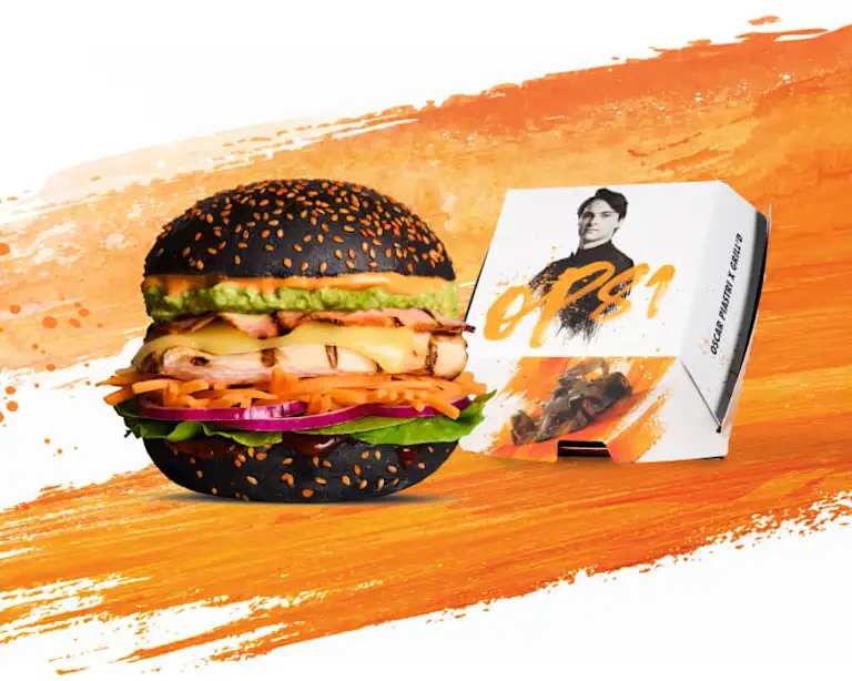 Oscar Piastri Chicken Burger with a black charcoal bun and limited edition packaging.