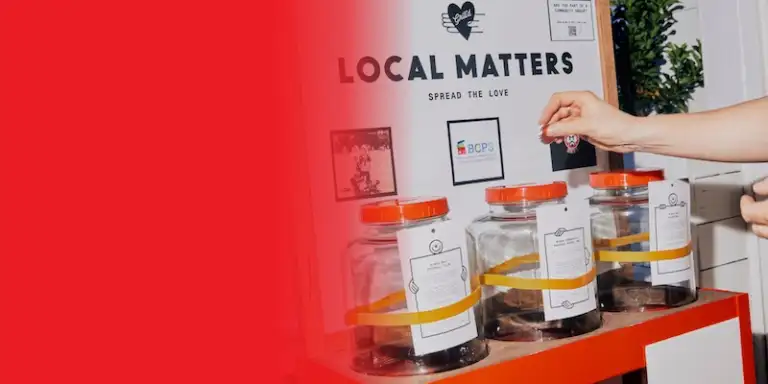 Token being dropped into a Local Matters jar