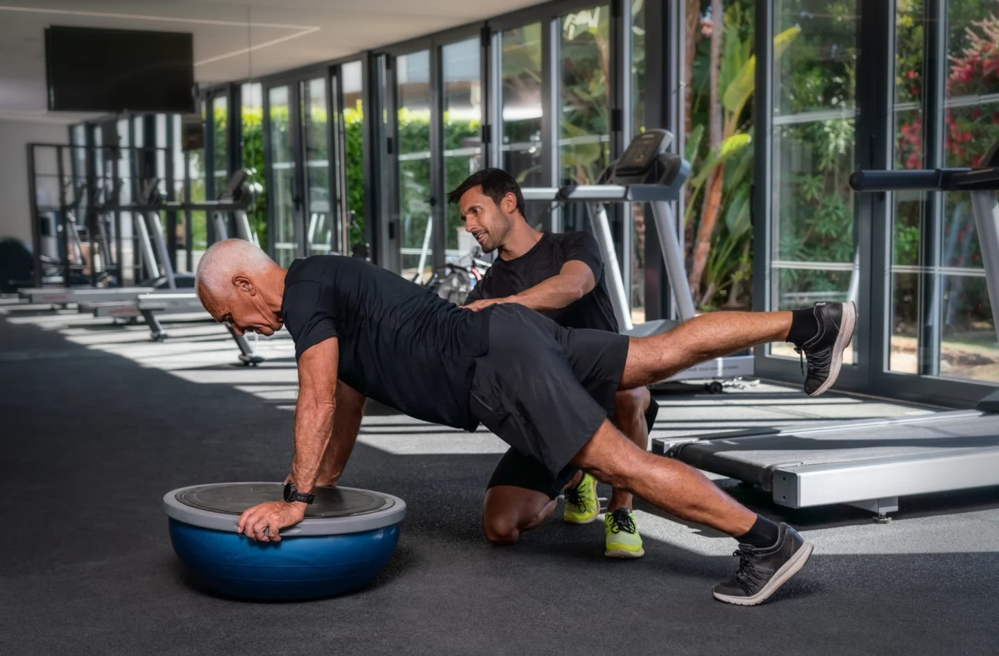 Elderly lady with ISSA Trainer for anchor point training