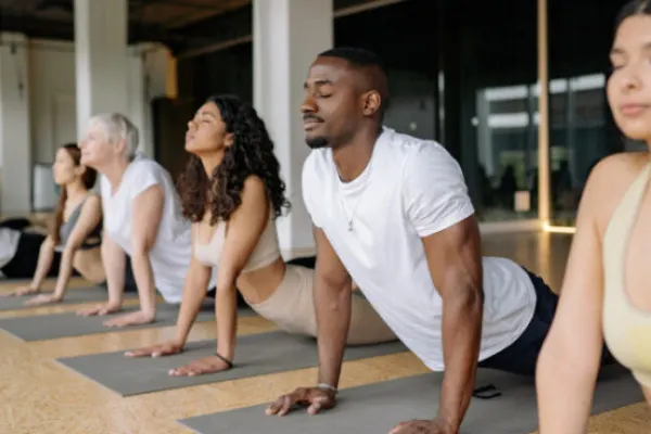 Group of students doing yoga poses