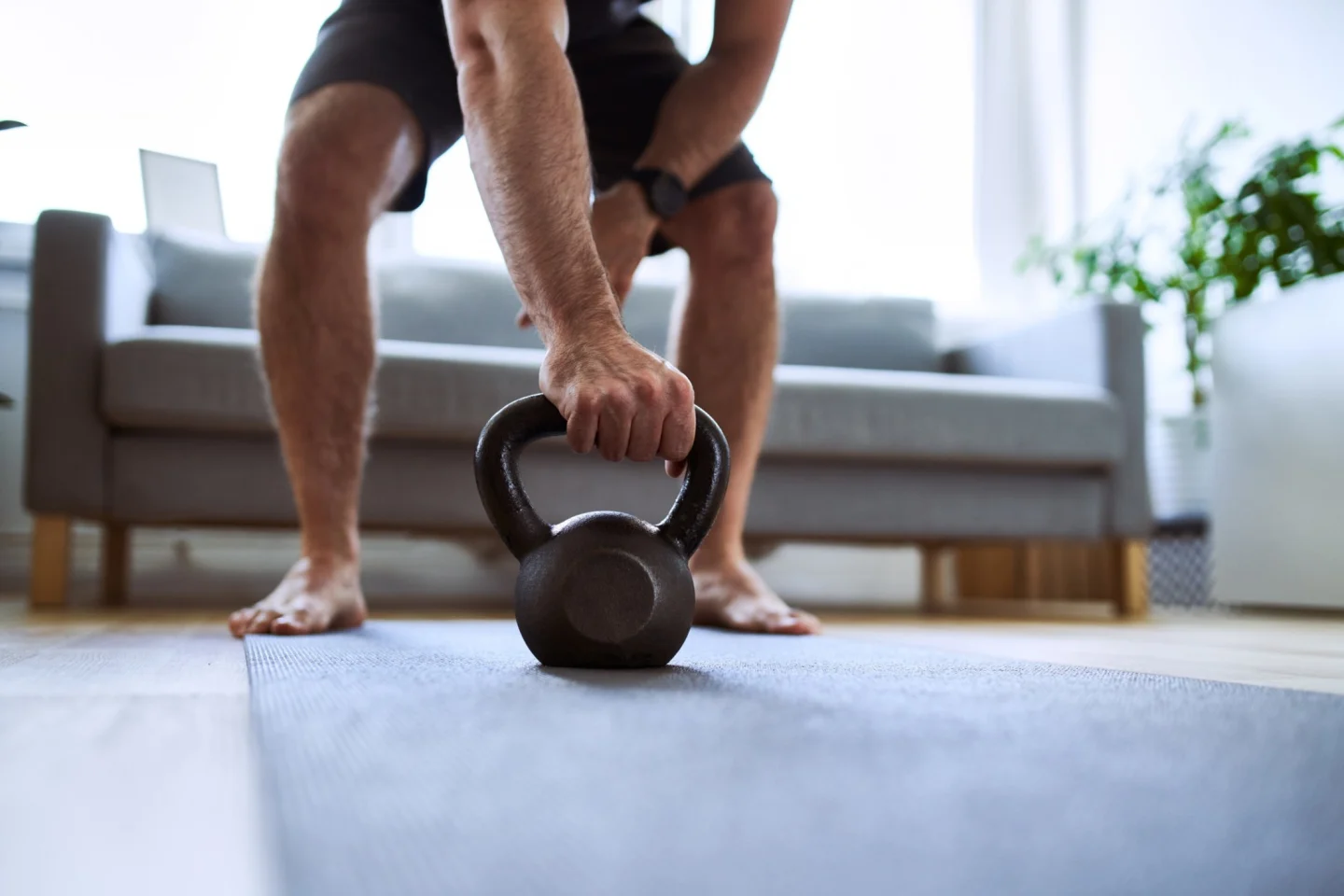 Elderly woman on yoga mat in a class