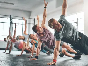 Male Trainer in a lunge position