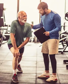 Senior working with an ISSA trainer