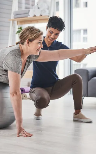 Trainer with client working on exercise therapy
