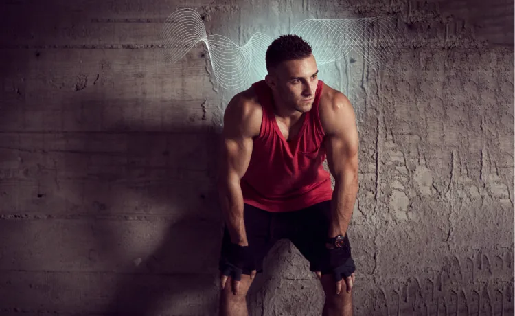 Trainer leaning against wall with brainwaves