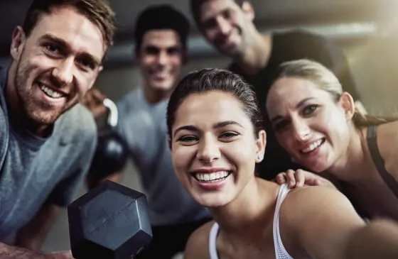 Workout group smiling for a picture.