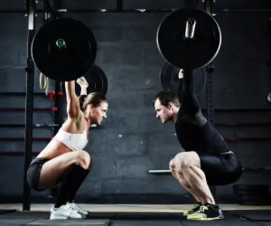 Powerlifting Specialist teaching a client proper deadlift form