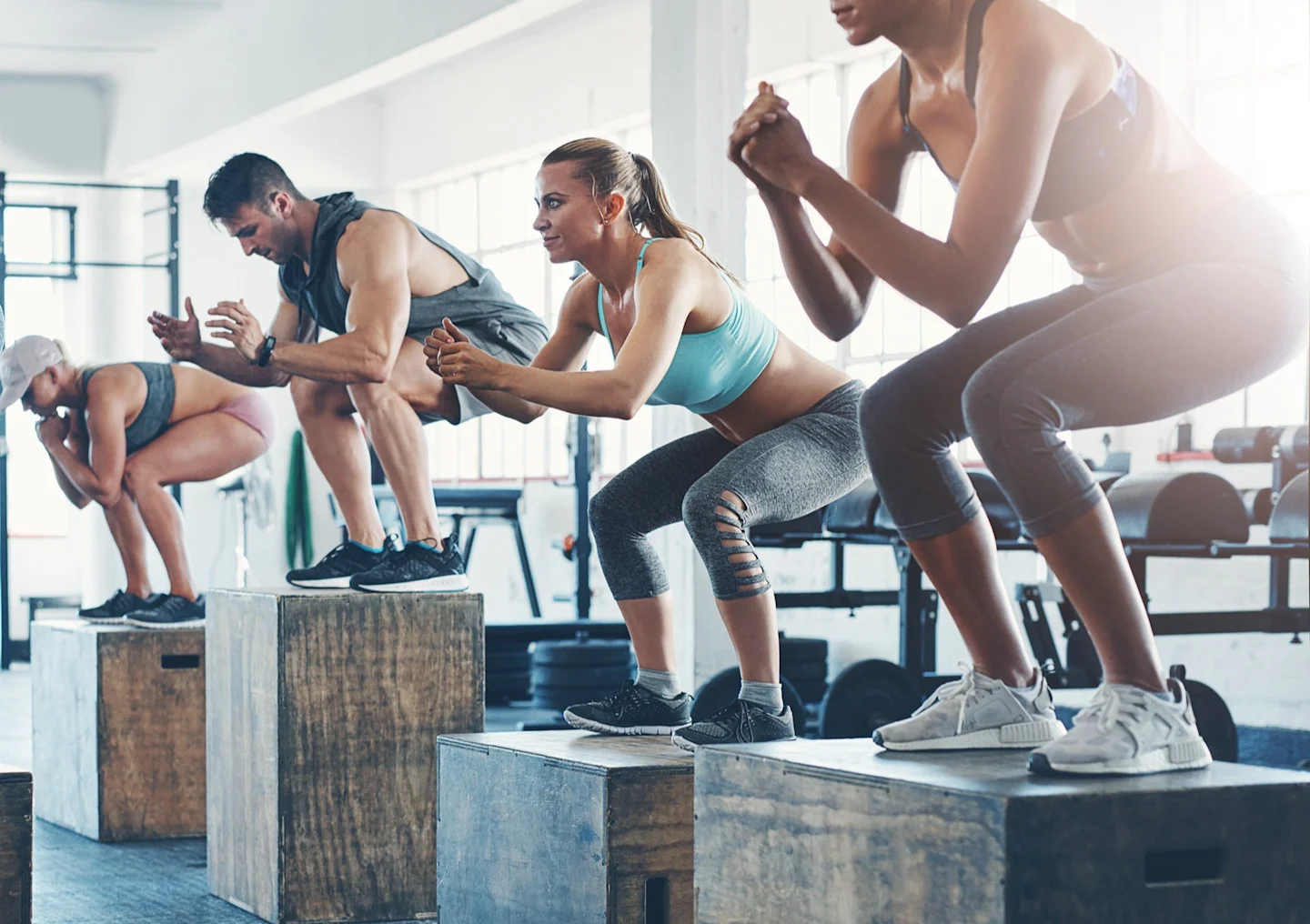 Trainers Doing Box Jumps