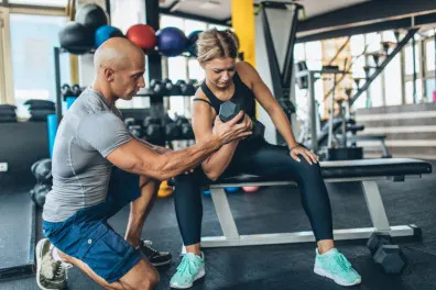 Fitness woman with her personal trainer