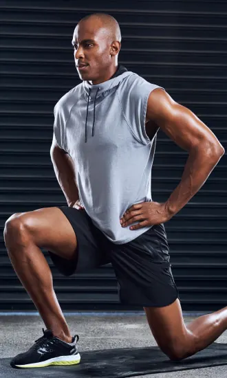 Male Trainer in a lunge position