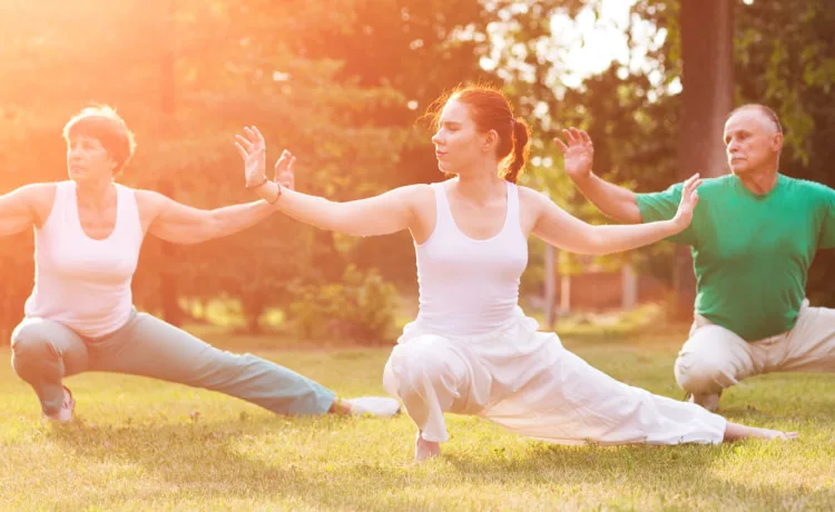 Group of mature adults practicing Tai Chi